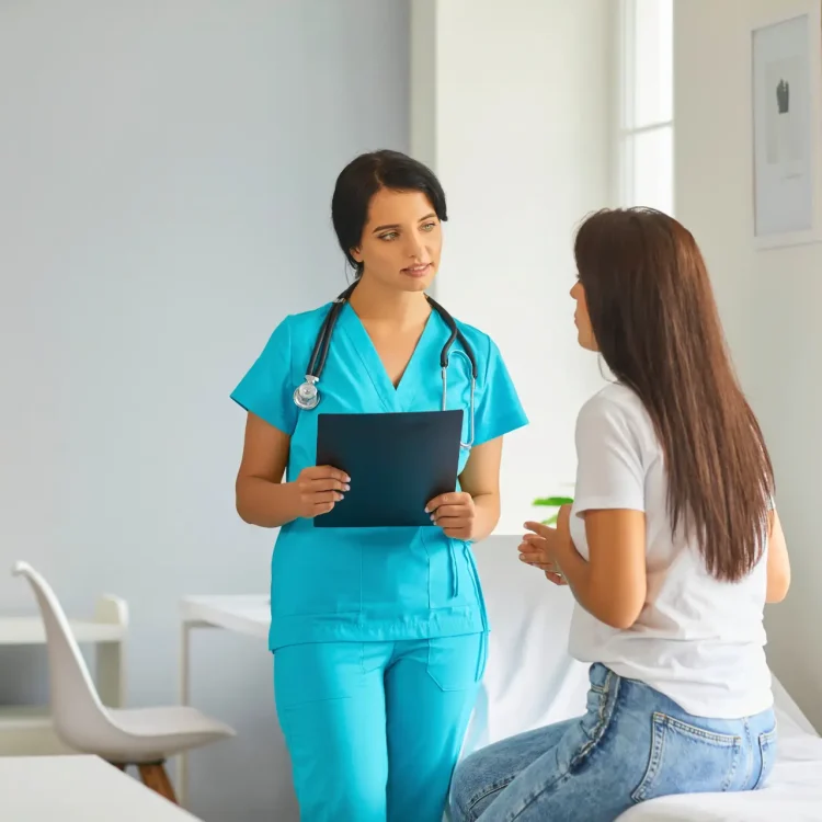 nurse speaking with patient
