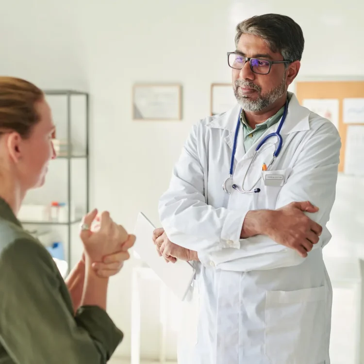 Physician speaking with patient